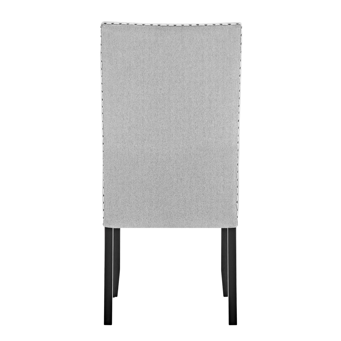 Back view of a grey upholstered dining chair with silver nailhead trim