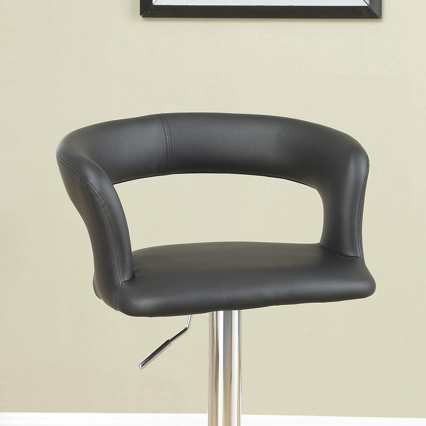 Black faux leather bar stool with curved back and silver adjustable lever