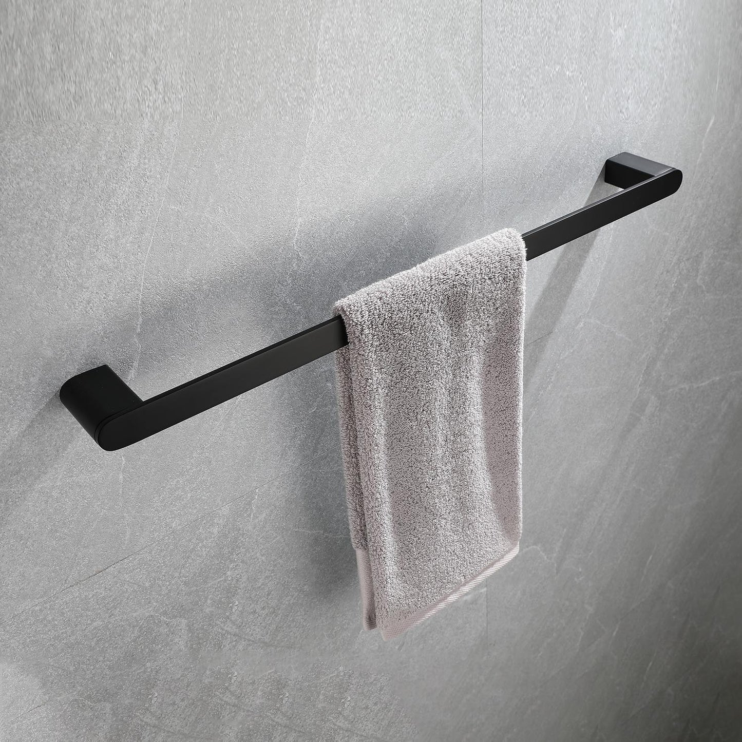 Modern black towel bar with a light grey textured towel