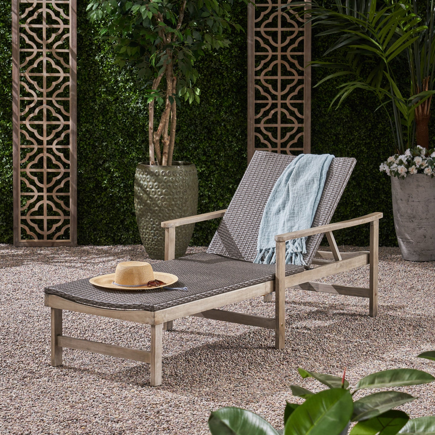 Gray woven chaise lounge with adjustable back includes light blue throw blanket and straw hat