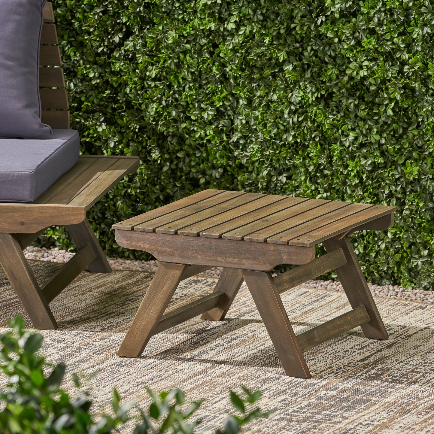 Rustic wooden side table with slatted top perfect for outdoor patios