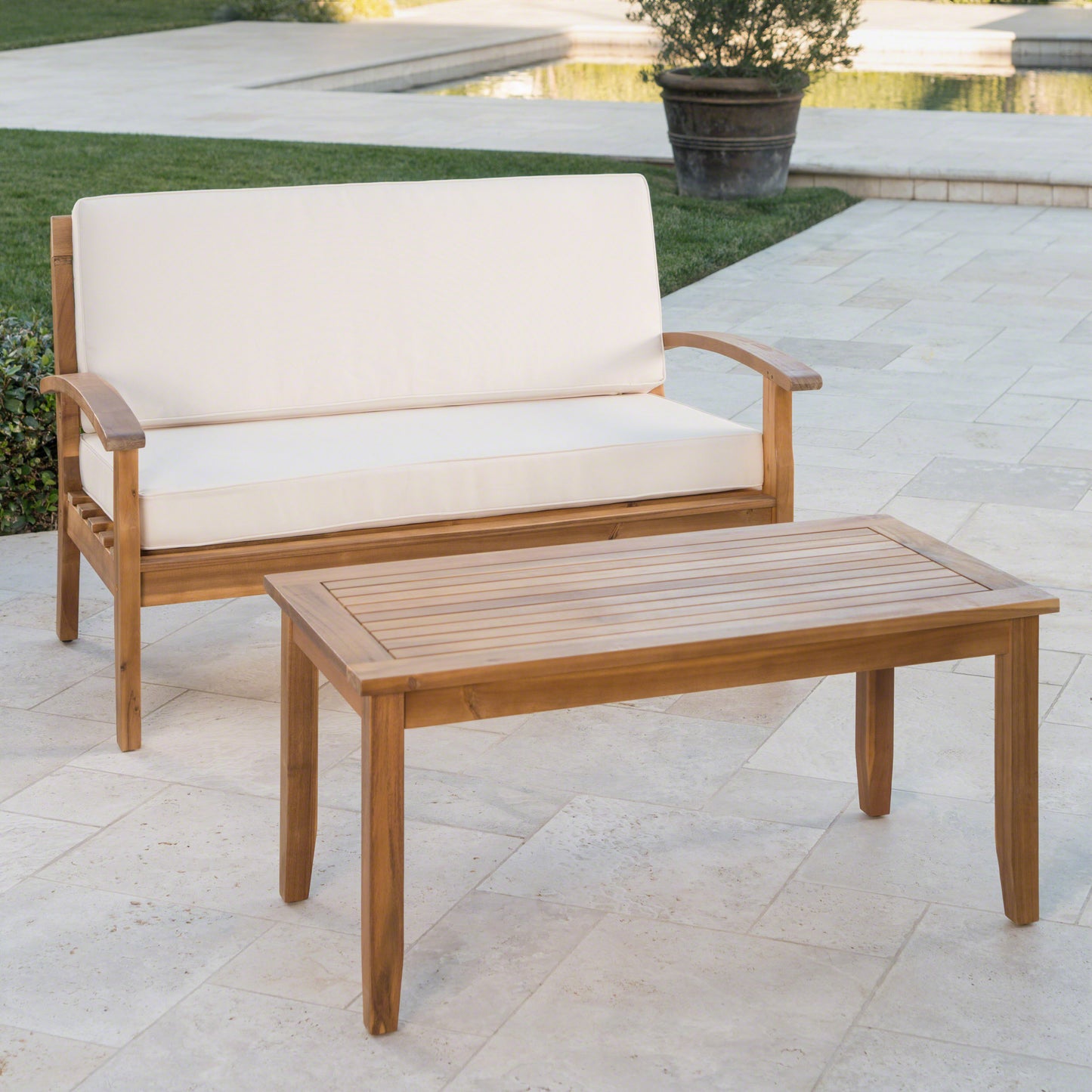 Wooden loveseat with cream cushions perfect for outdoor patios