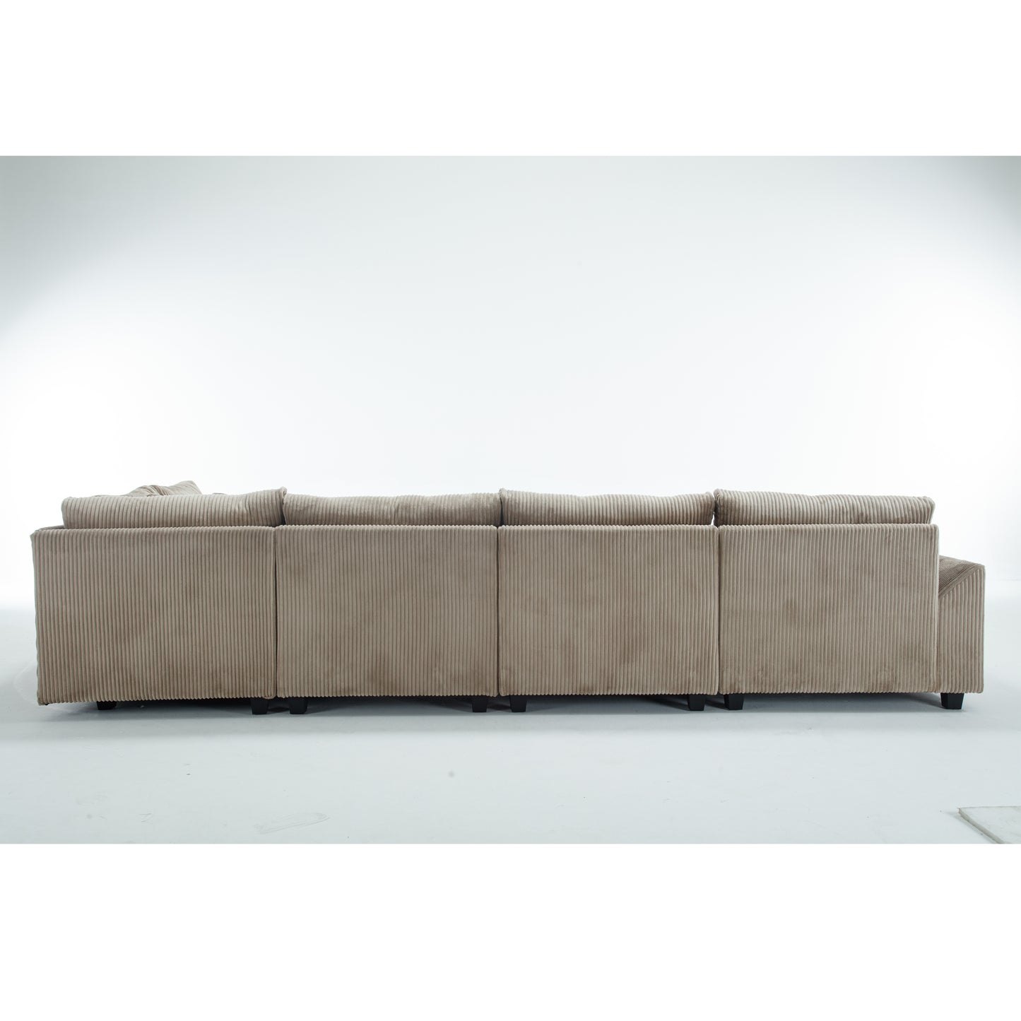 Taupe corduroy sectional sofa with plush cushions and dark wood legs