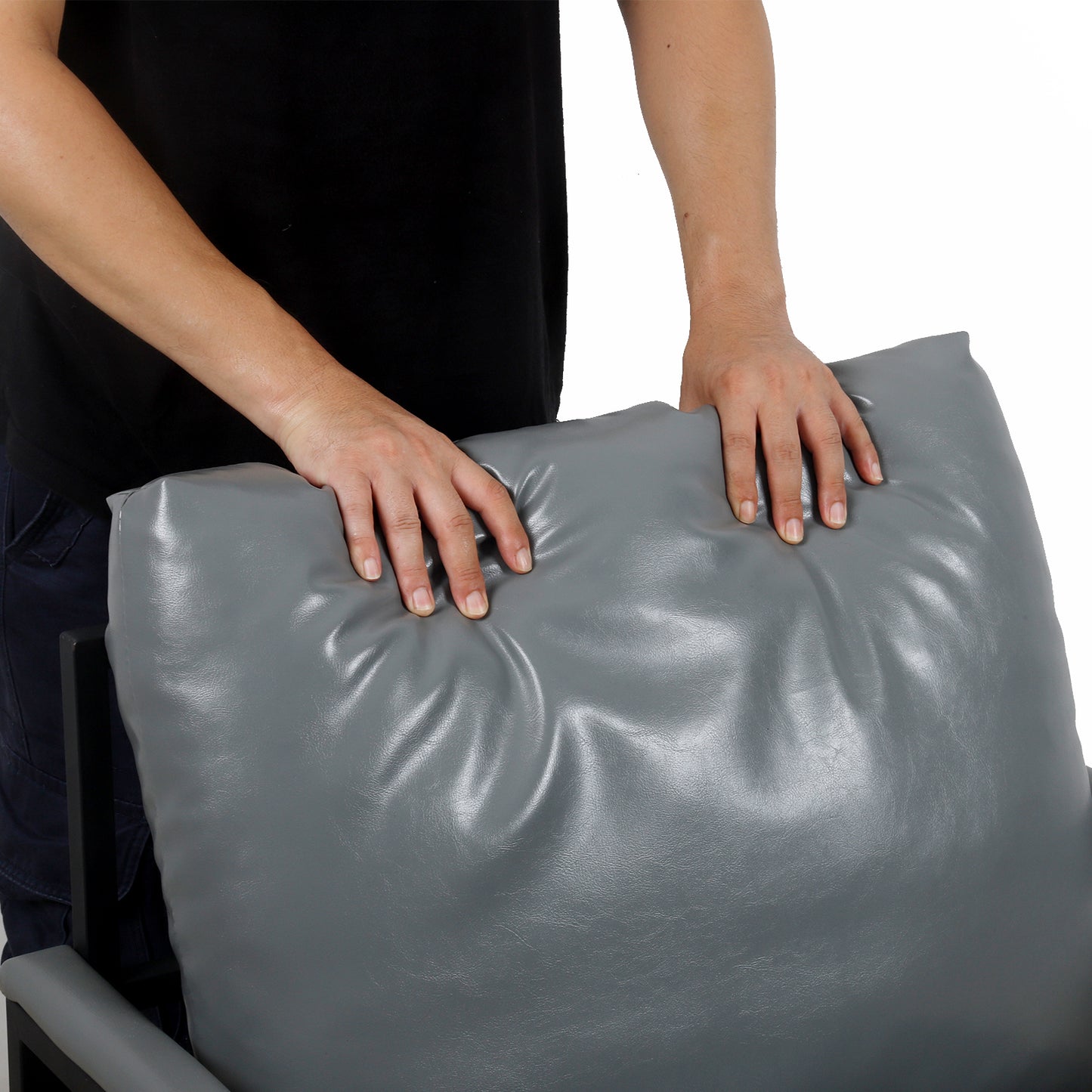 Plush grey faux leather throw pillow with soft yielding texture for comfort