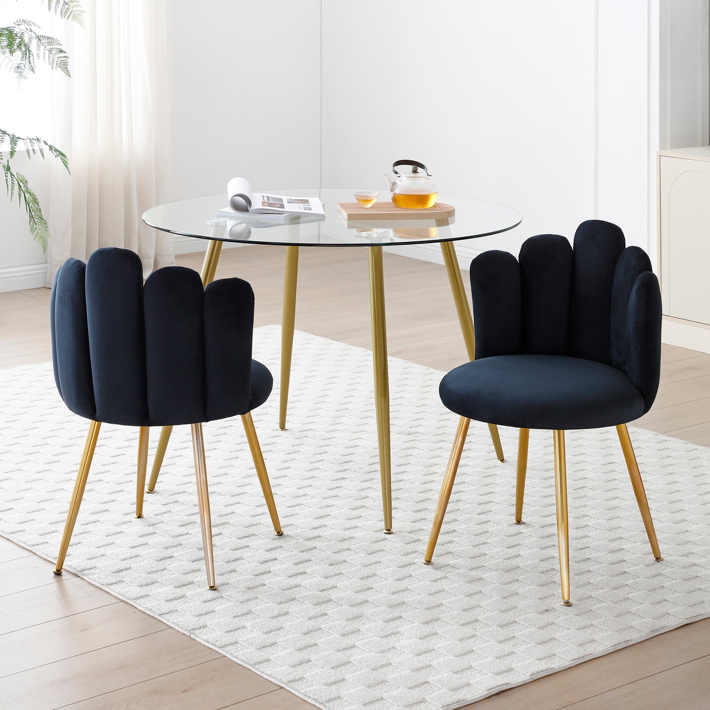 Dark navy velvet accent chair with petaled back and gold legs