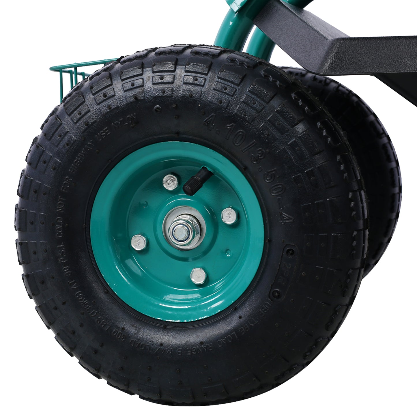 Closeup of a green metal rim on a pneumatic garden cart wheel with black tire