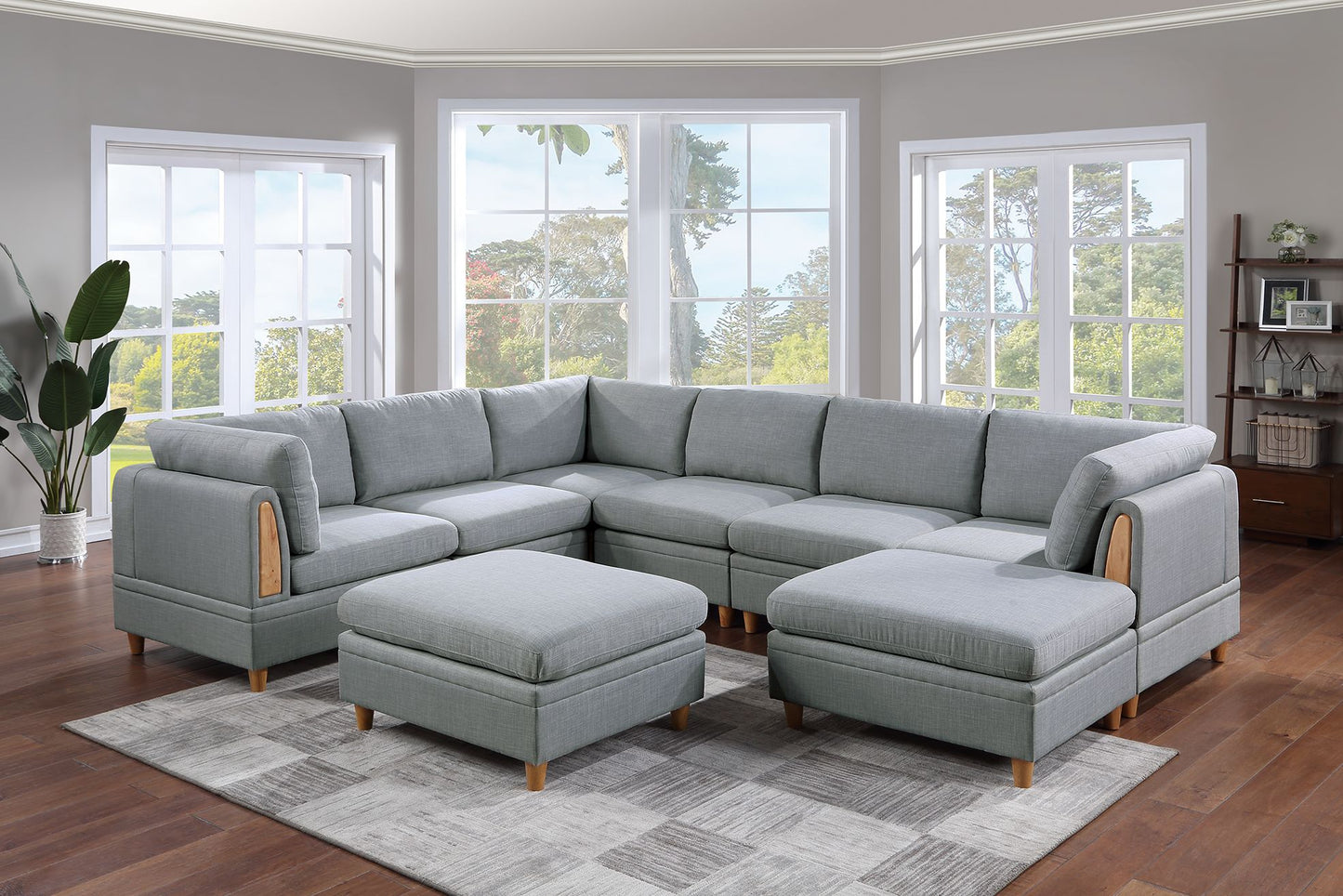 Gray fabric sectional sofa with wooden arm accents and matching ottomans for living room seating
