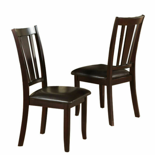 Two dark brown wooden dining chairs with black leather seats