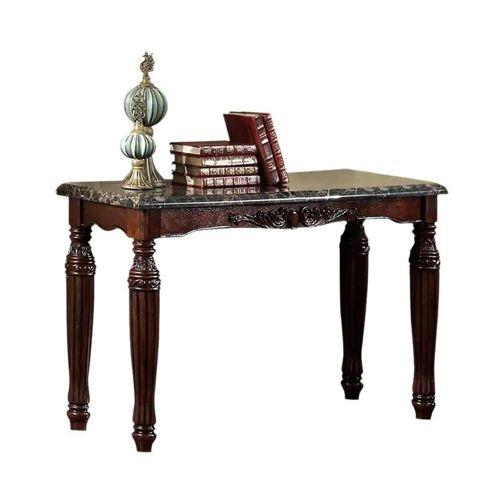 Ornate dark wood console table with a marble top featuring carved details and ornate legs