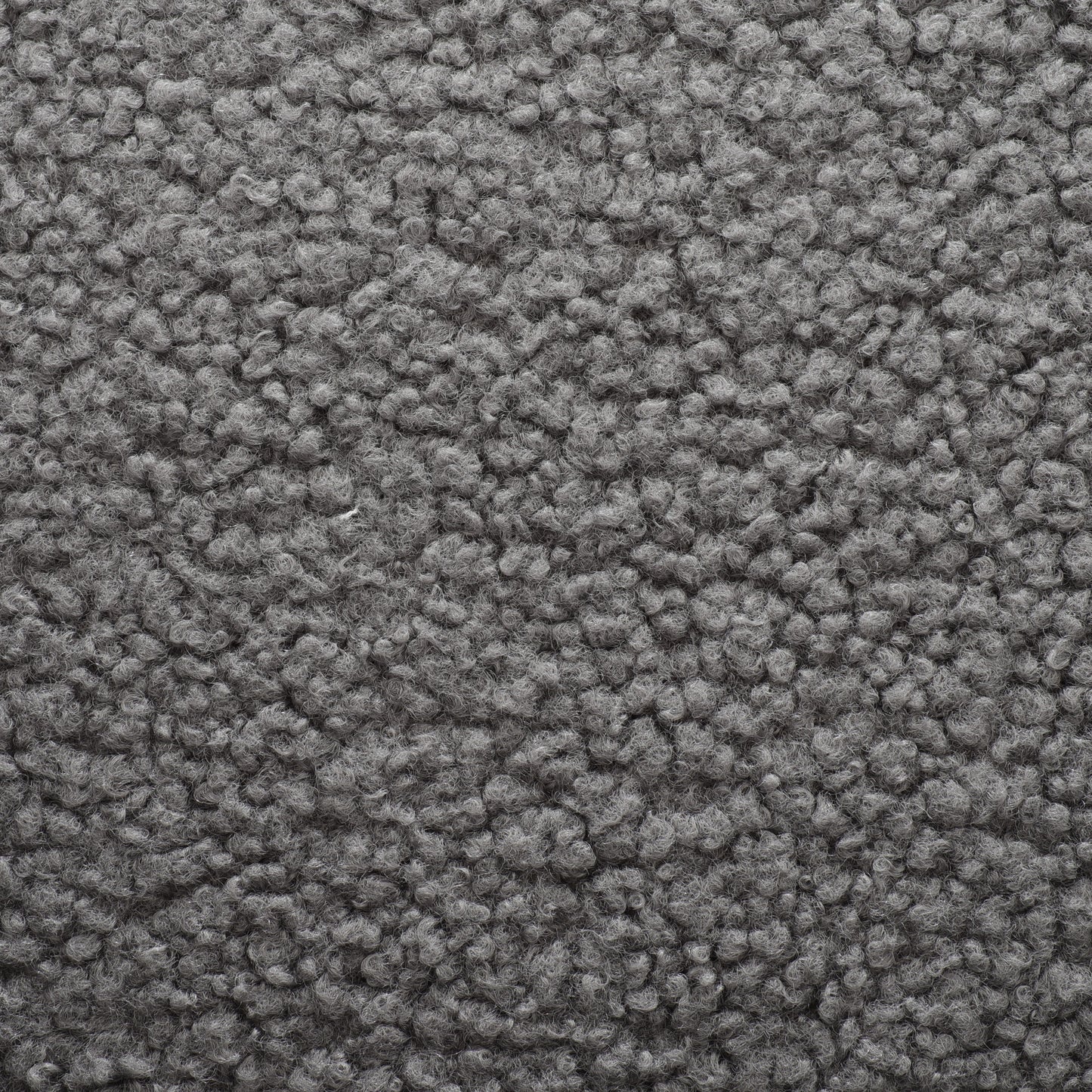 Closeup view of textured grey sherpa fabric perfect for cozy apparel and home decor