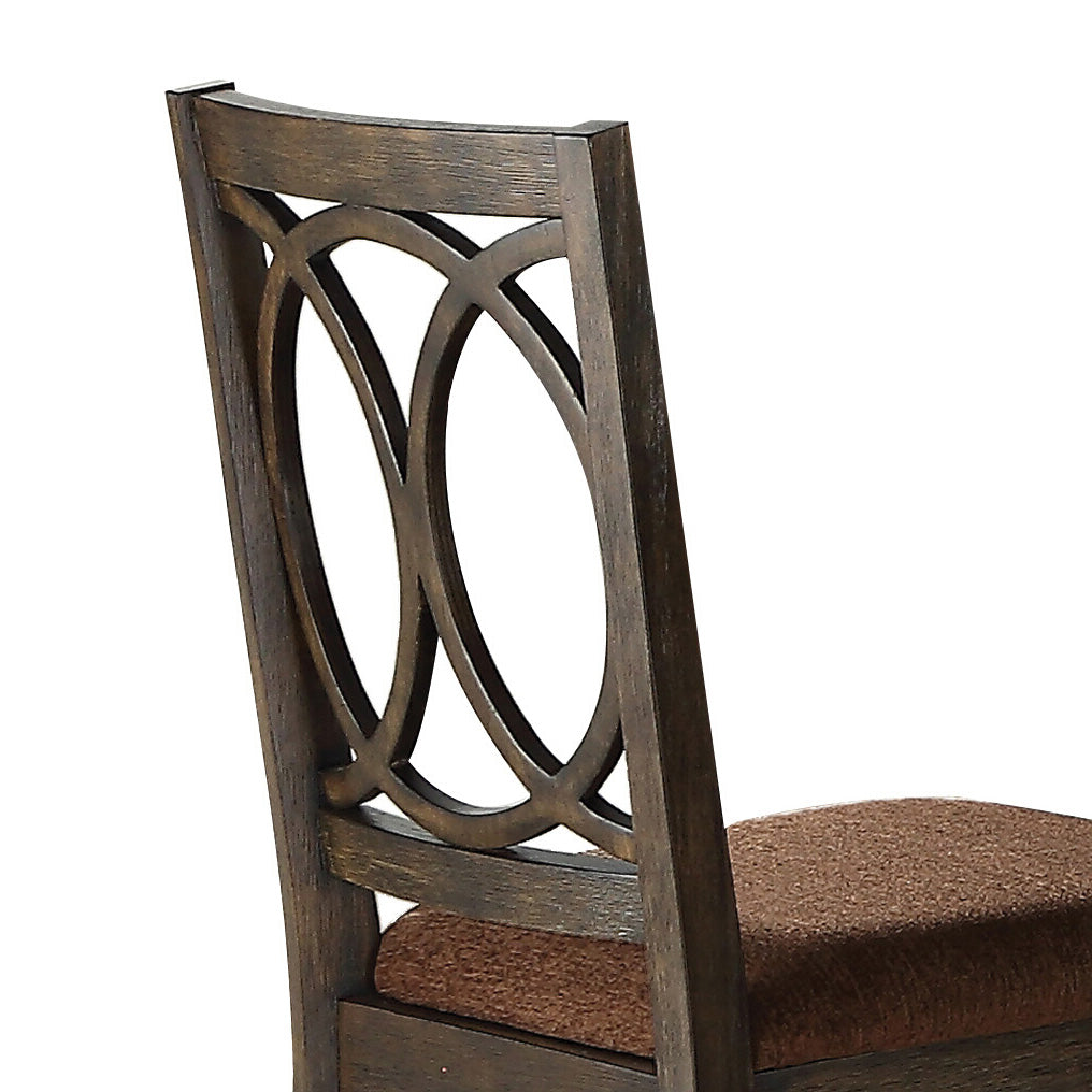Dark oak dining chair with intricate oval back design and brown textured seat