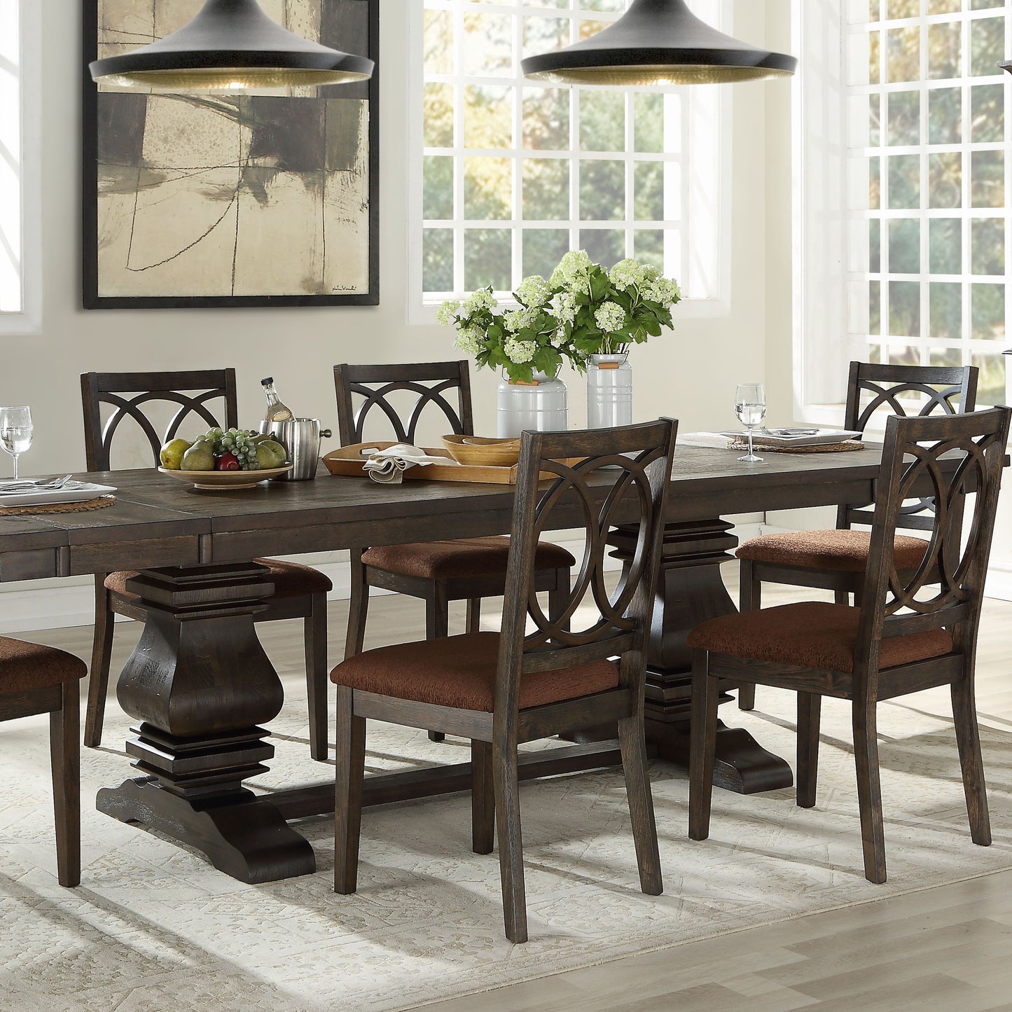 Dark oak dining table set with upholstered chairs featuring intricate back designs