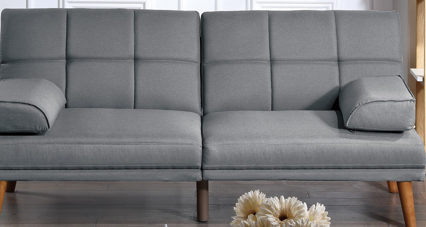 Tufted grey fabric sofa with plush cushions and wooden legs perfect for a living room