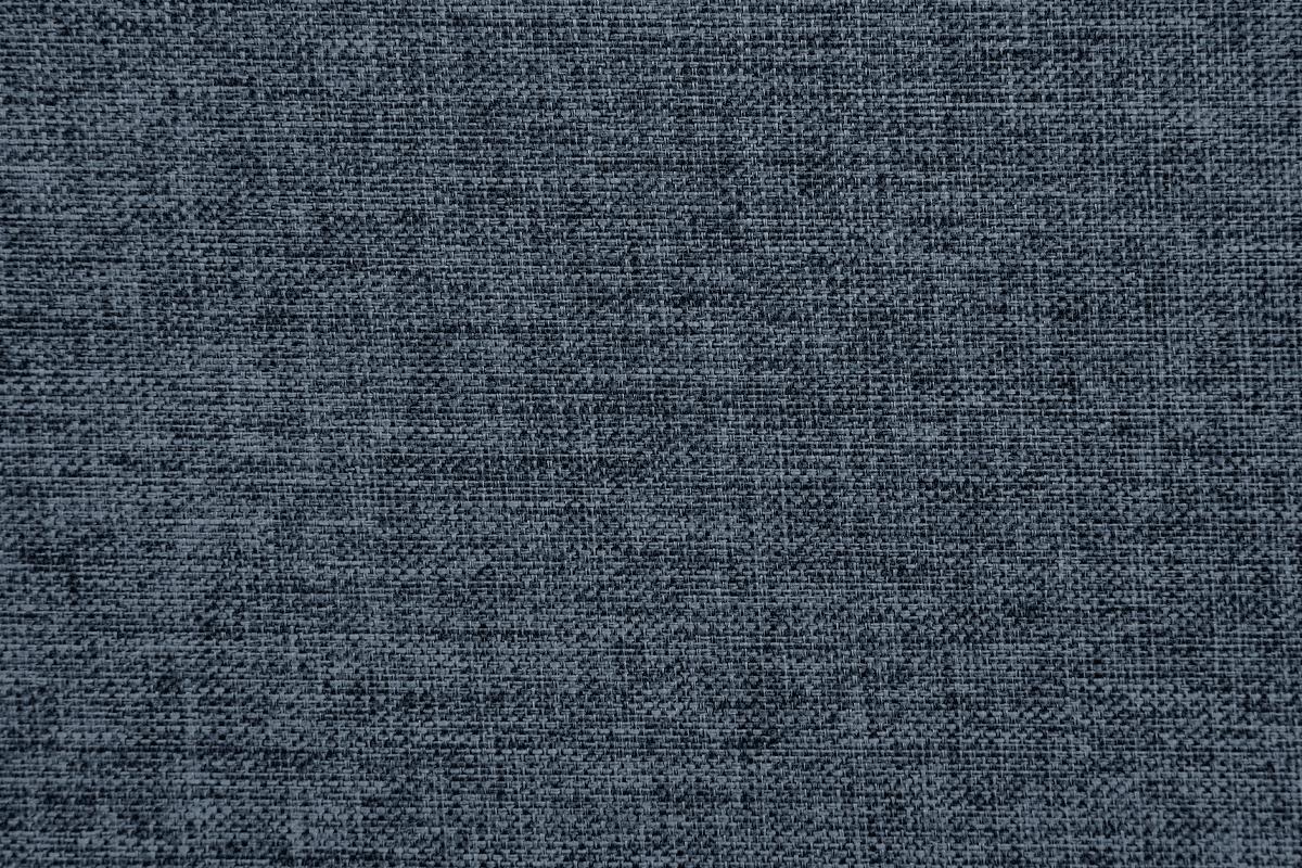 Closeup of a textured dark grey polyester upholstery fabric