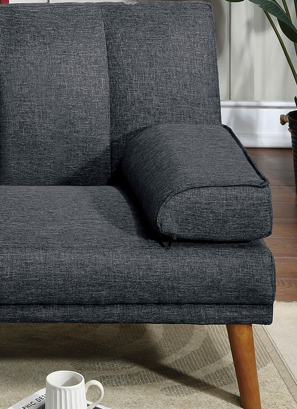 Charcoal grey fabric sofa closeup showing textured upholstery and wooden legs