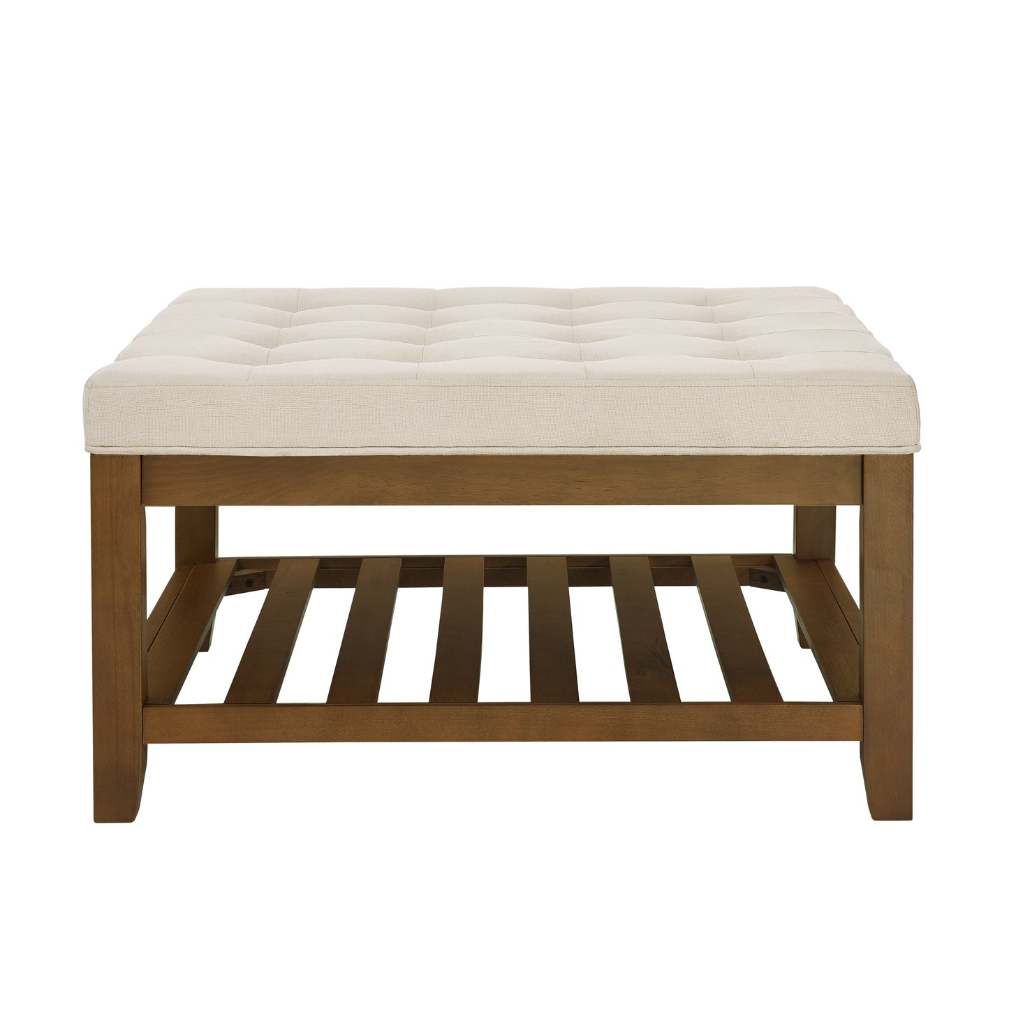 Tufted cream fabric upholstered ottoman bench with a dark wood slatted shelf below