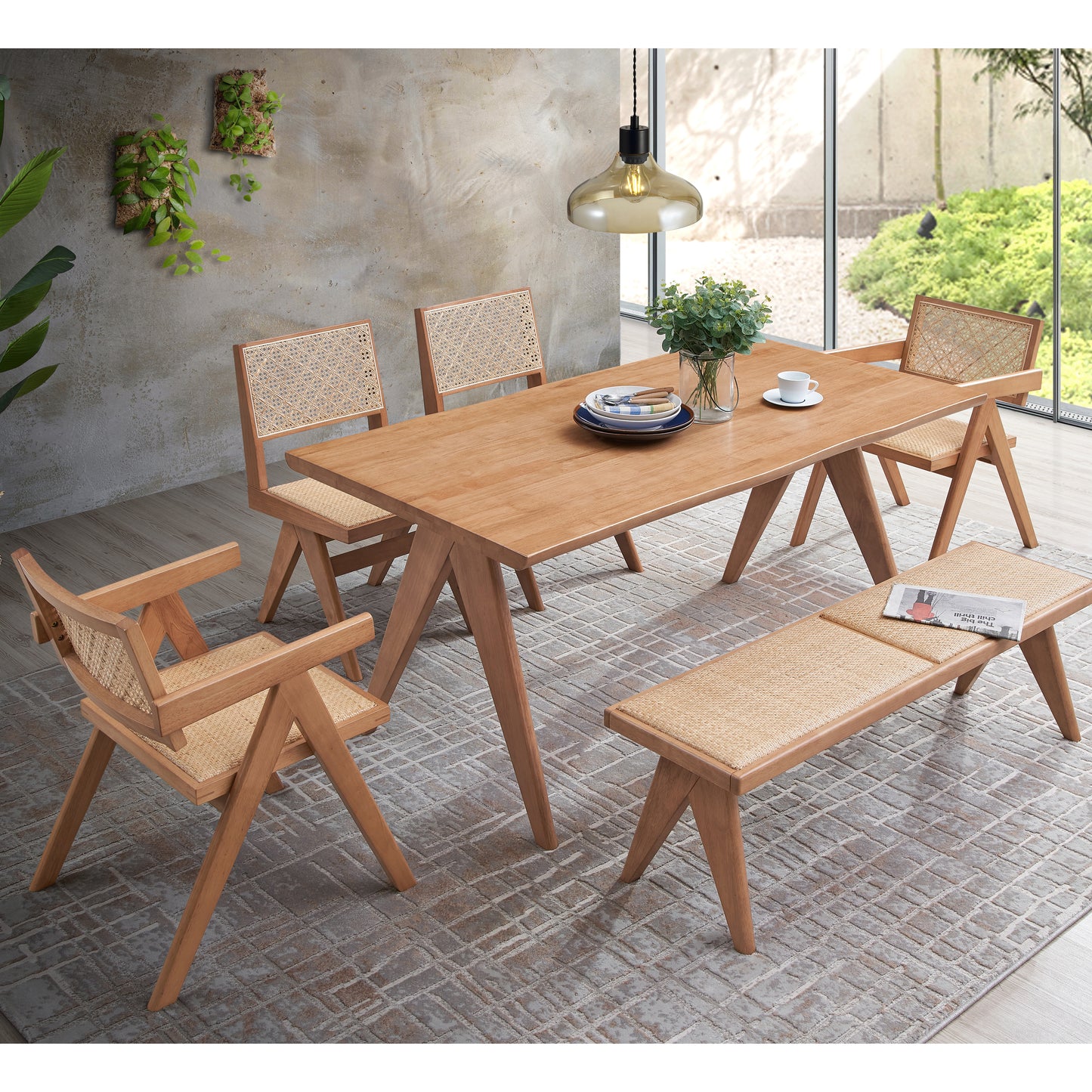 Modern wooden dining table with woven cane chairs and bench