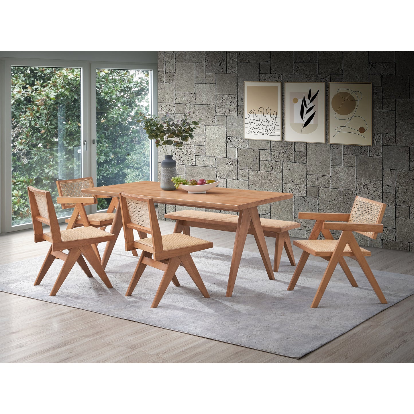 Wooden dining table with four natural rattan accent chairs
