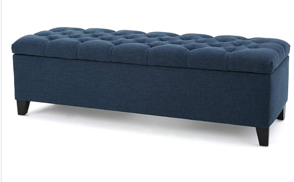 Navy blue tufted storage ottoman with dark wooden legs perfect for living rooms
