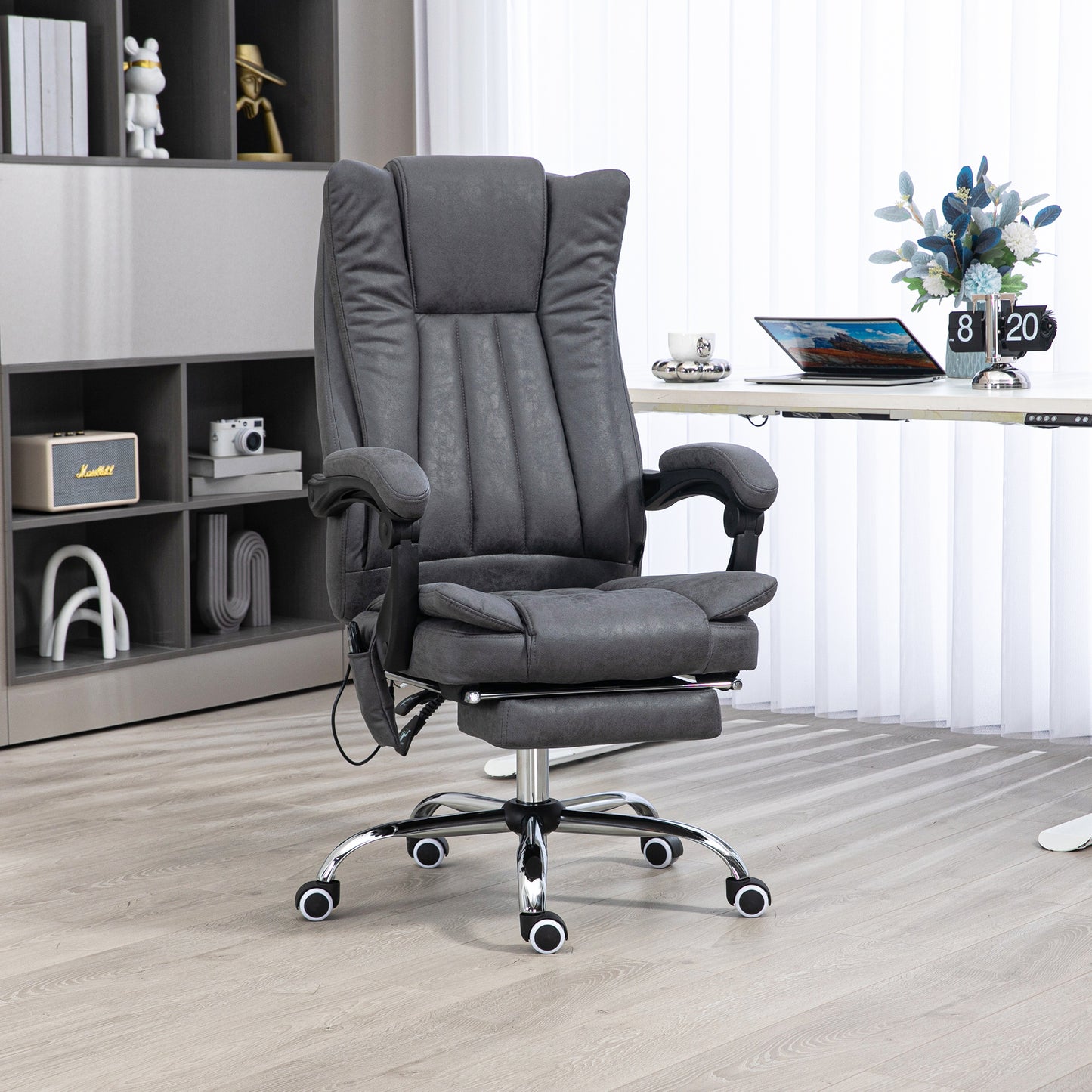 Dark gray executive office chair with footrest and lumbar massage function