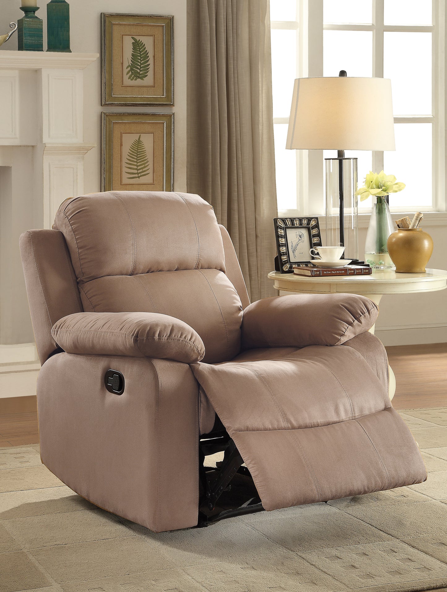 Plush taupe fabric recliner with padded arms and footrest extended for ultimate comfort