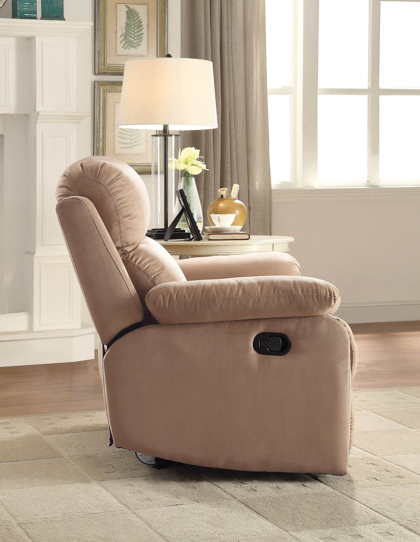 Taupe fabric recliner chair with plush cushioning and side lever for easy reclining