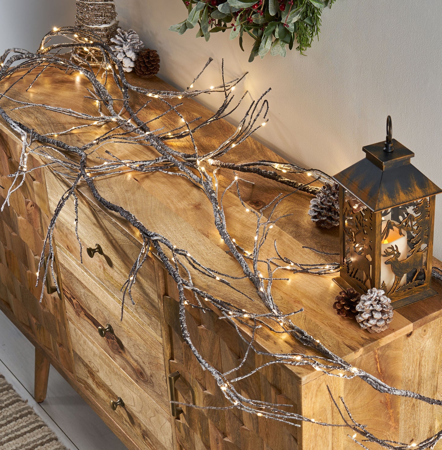 Frosted twig garland with warm LED fairy lights perfect for festive holiday decor