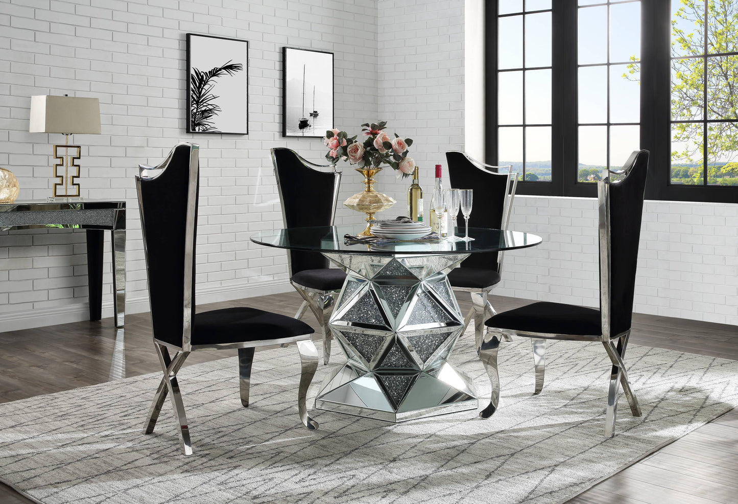 Glamorous mirrored geometric dining table base with glass top and black velvet chairs