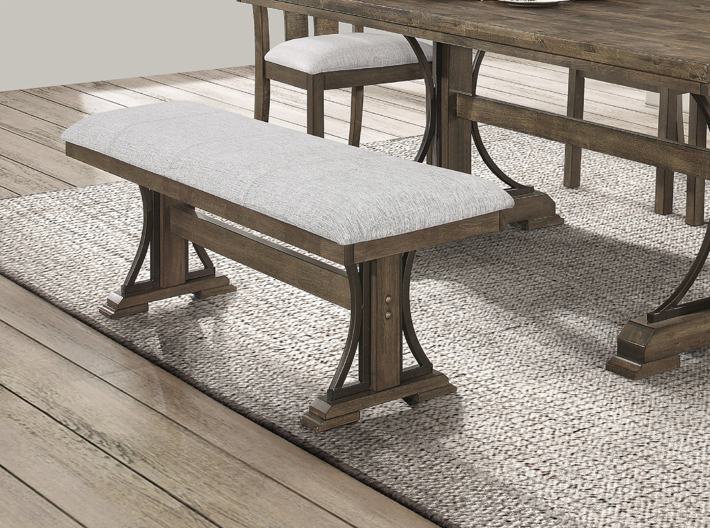 Farmhouse dining bench with upholstered light gray seat and dark wood frame