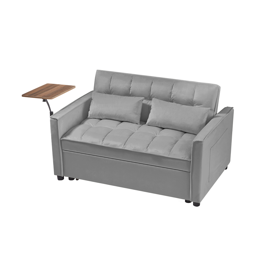 Grey velvet sofa bed with tufted cushions and a side tray