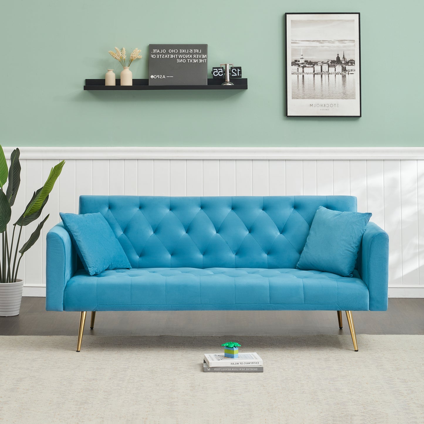 Tufted blue velvet sofa with diamond tufting and gold legs perfect for modern living rooms
