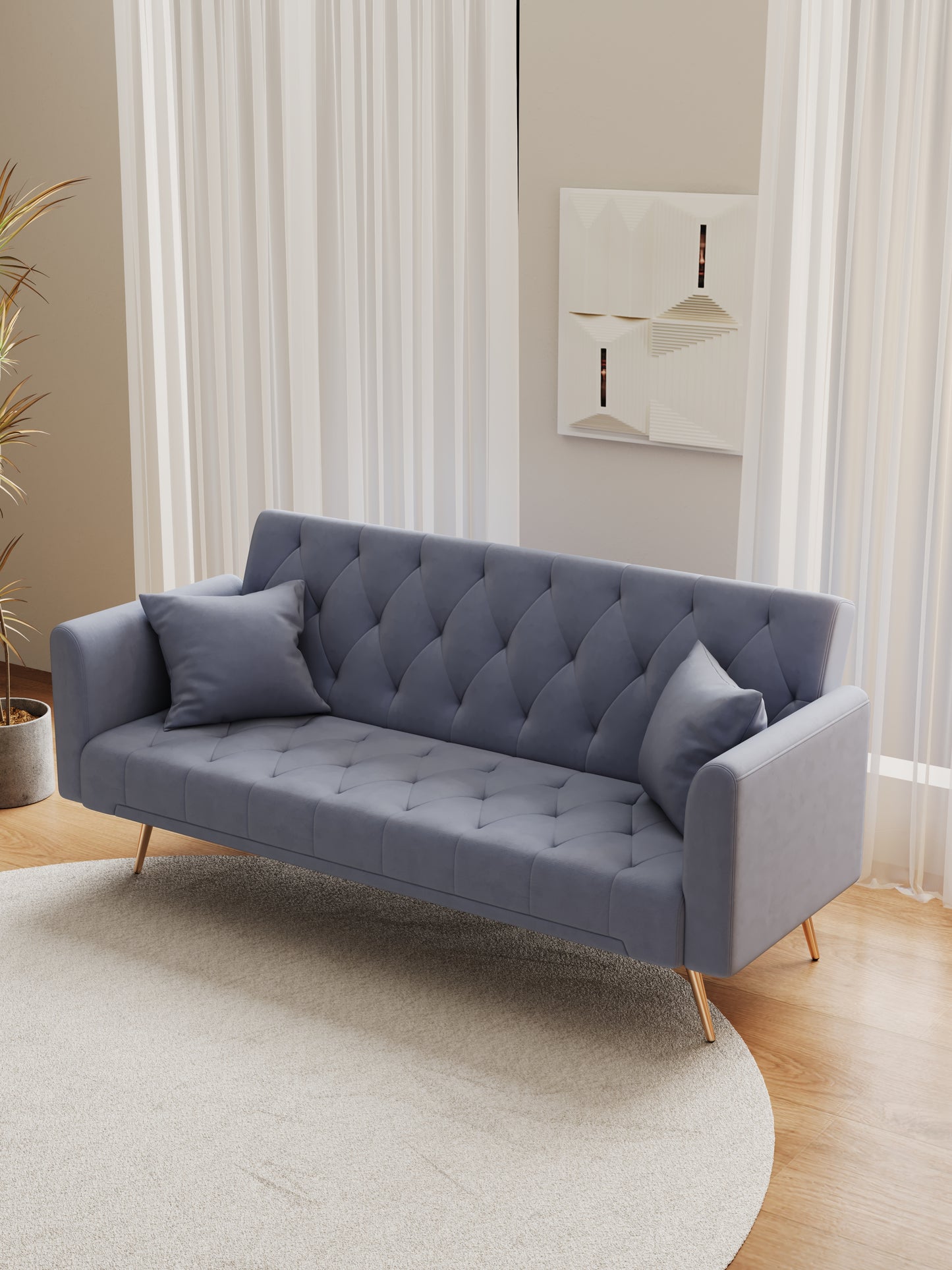 Tufted grey velvet sofa with gold legs and decorative pillows perfect for modern living rooms
