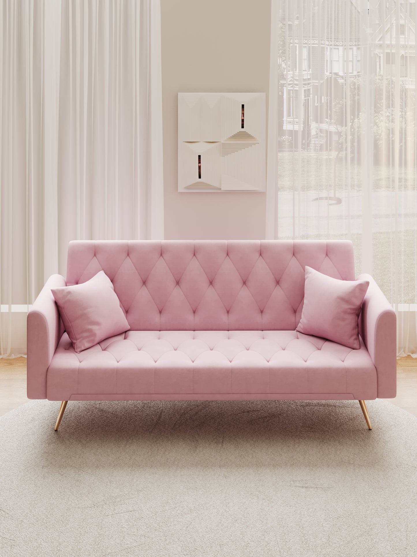 Pink velvet tufted sofa with gold legs and decorative pillows