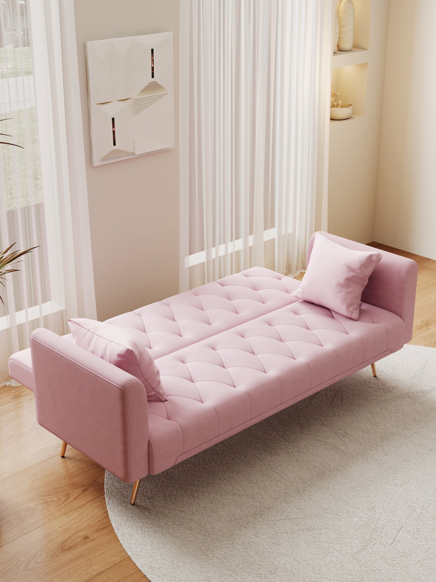 Pink velvet futon sofa with tufted cushions and gold legs for small spaces