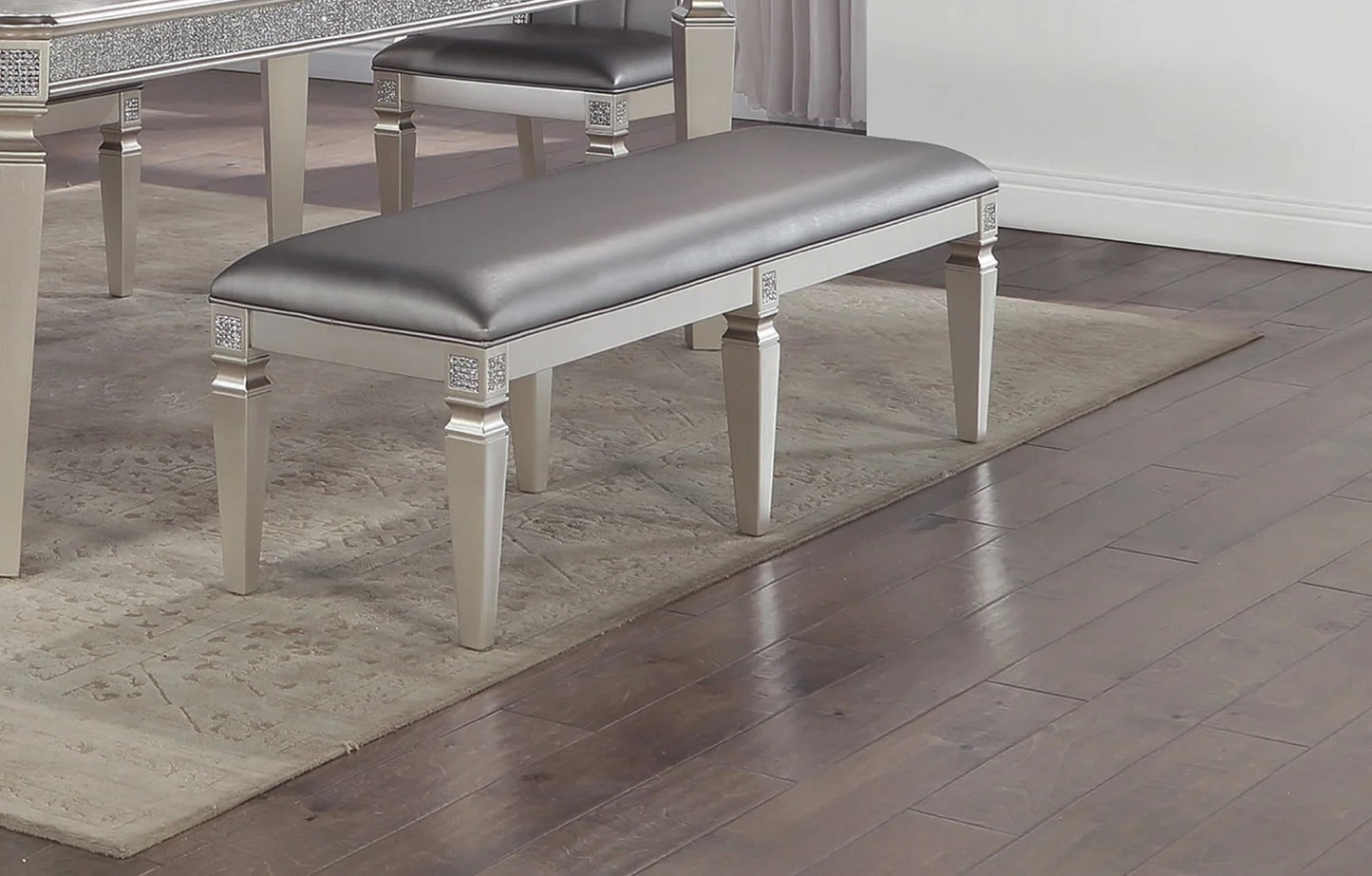 Silver faux leather bench with crystal accents and elegant carved legs