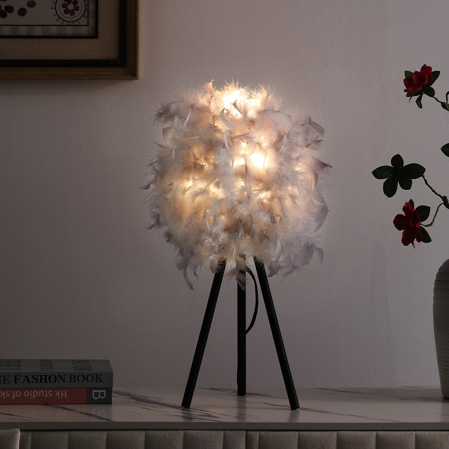 Fluffy white feather globe table lamp with black tripod base soft ambient light