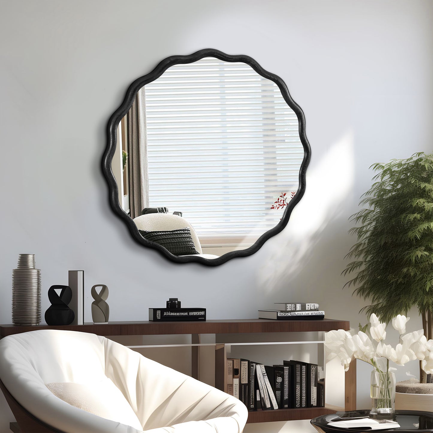 Scalloped black wall mirror with an organic wavy frame for modern living rooms