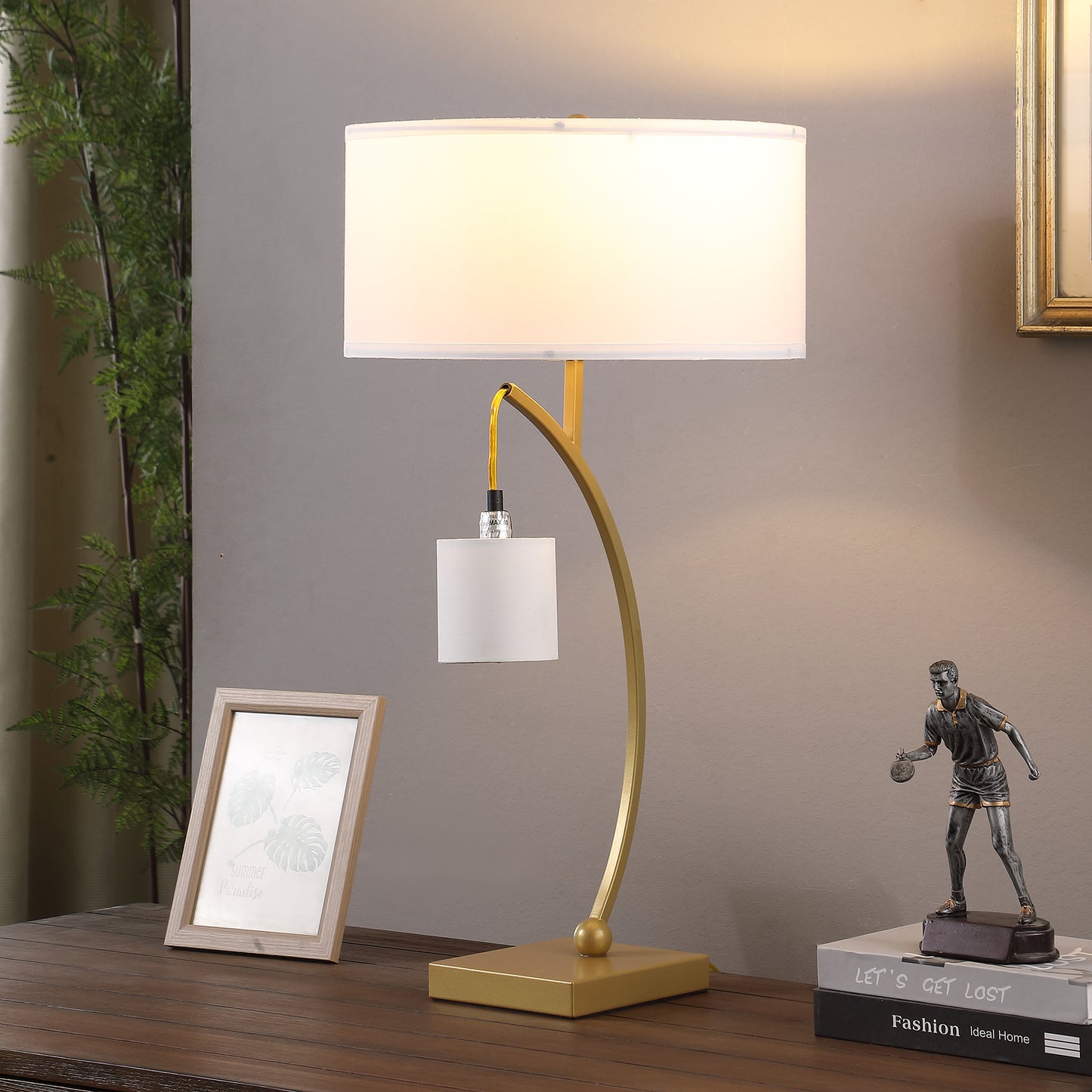 Modern gold metal table lamp with white drum shade ideal for ambient lighting
