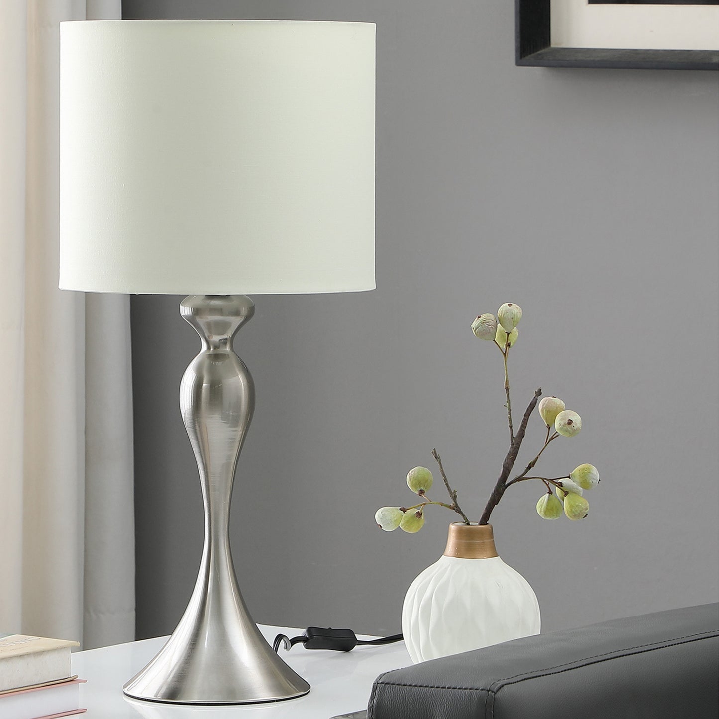 Modern brushed nickel table lamp with cream fabric shade perfect for bedside tables
