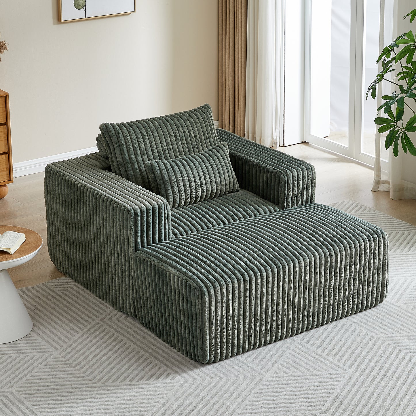 Sage green corduroy sectional sofa with plush cushions and ottoman