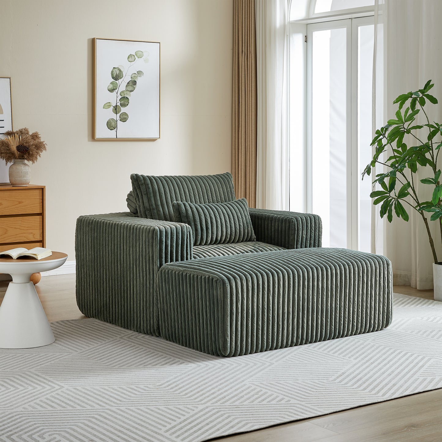 Plush corduroy armchair in sage green with matching ottoman creating a cozy seating area