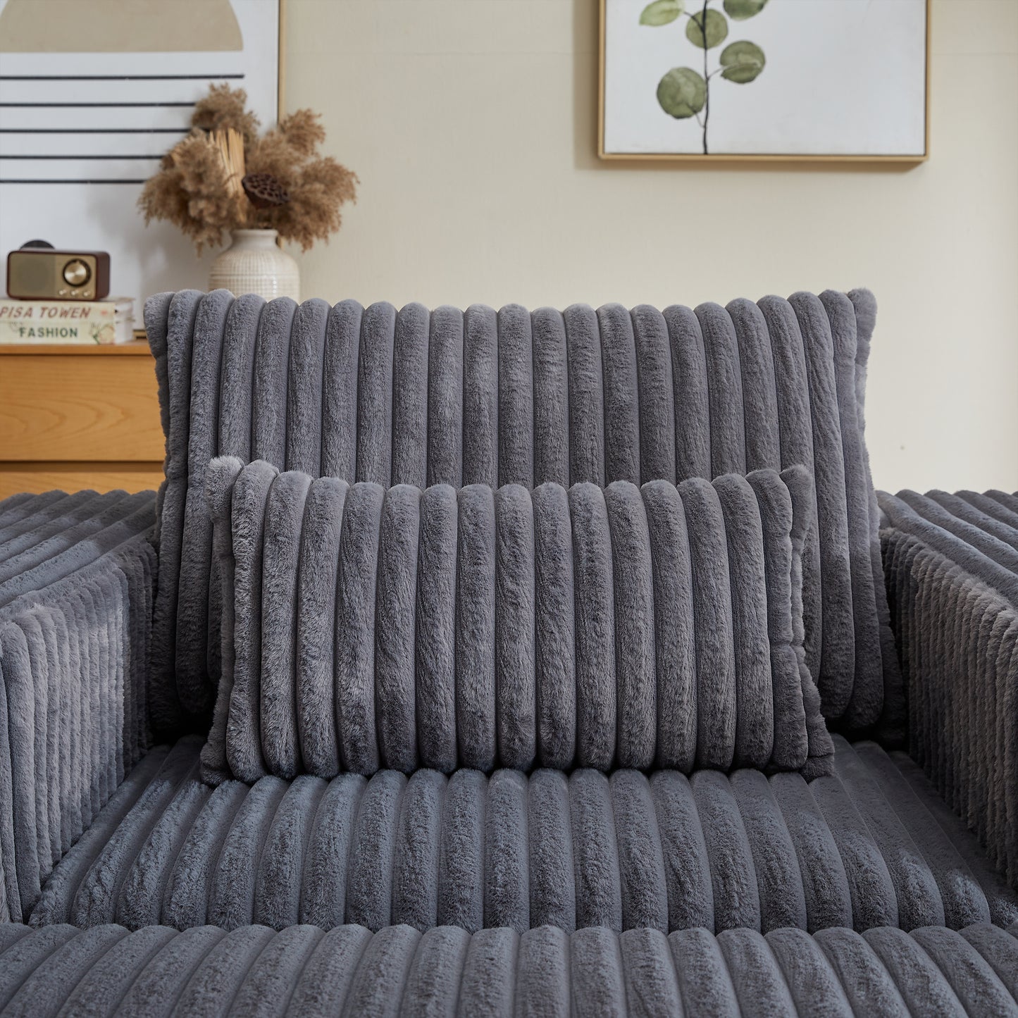 Plush dark grey corduroy throw pillow with vertical channel tufting for cozy home decor