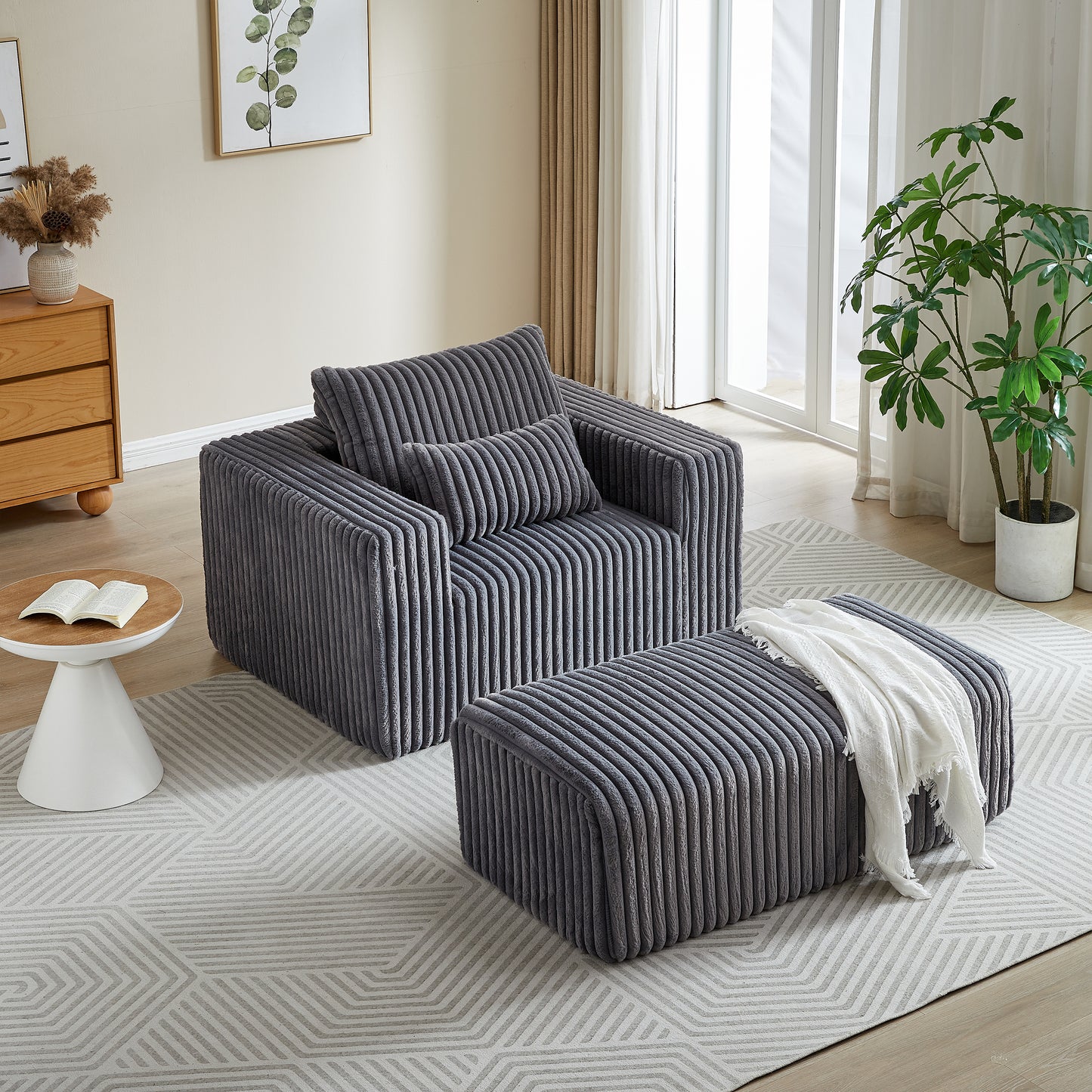 Modern grey corduroy armchair with matching ottoman and throw pillow