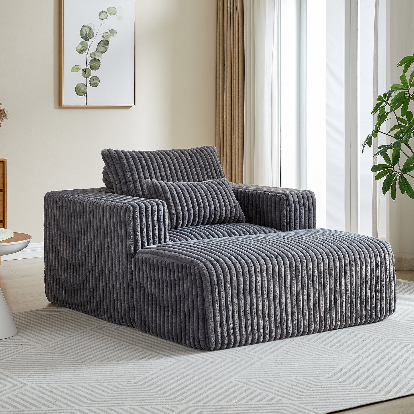 Plush gray corduroy armchair with matching ottoman perfect for a cozy living room