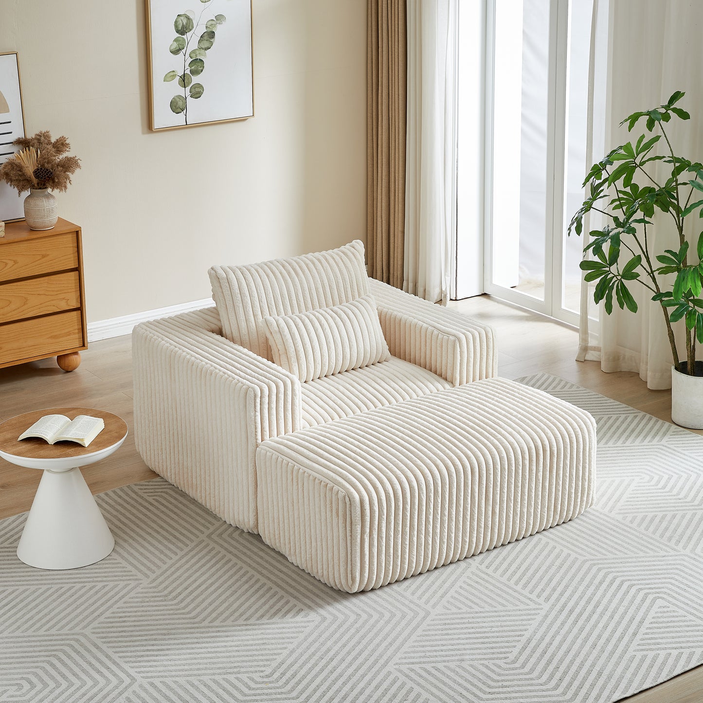 Plush cream corduroy armchair with matching ottoman and accent pillow