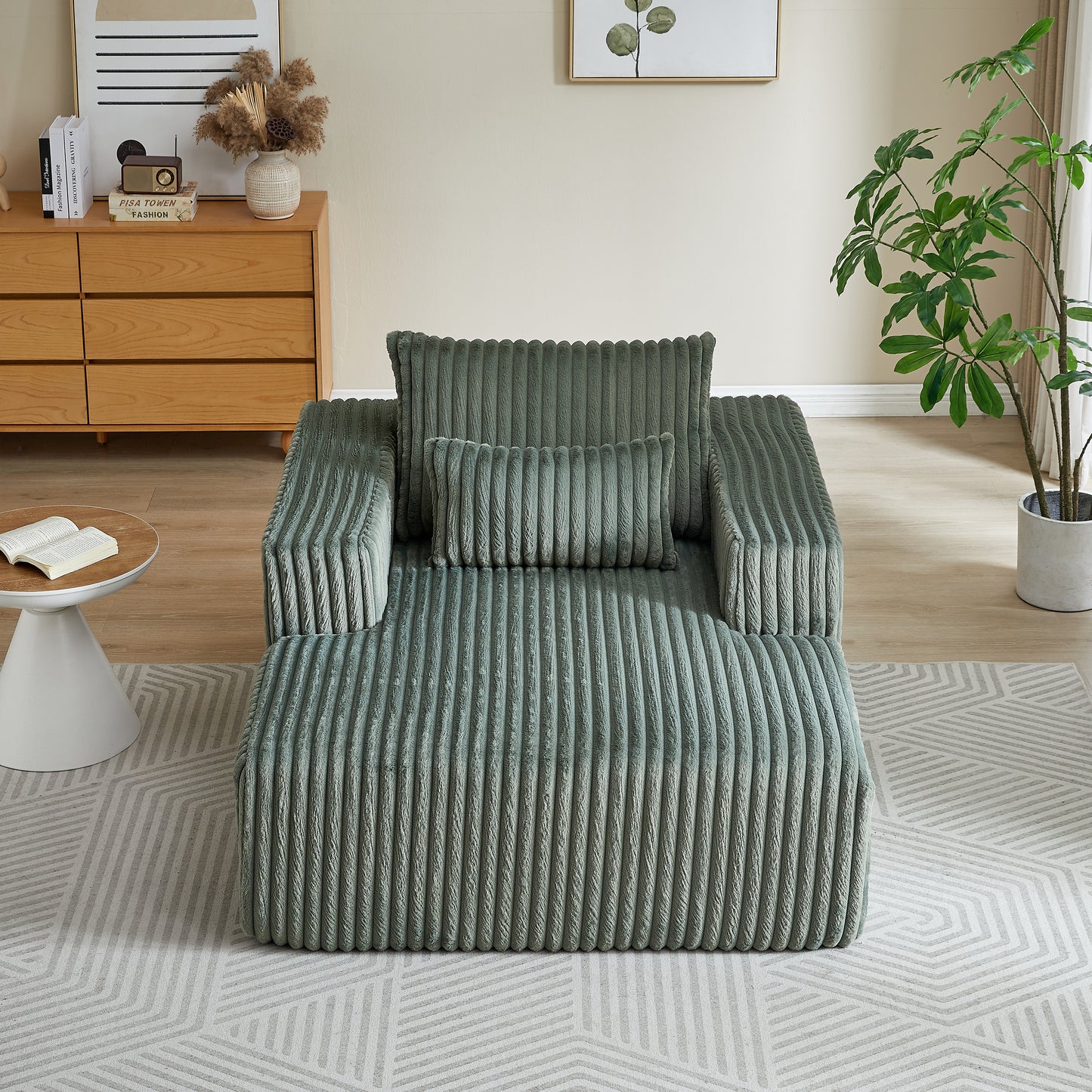 Sage green corduroy sofa with plush texture and matching throw pillows