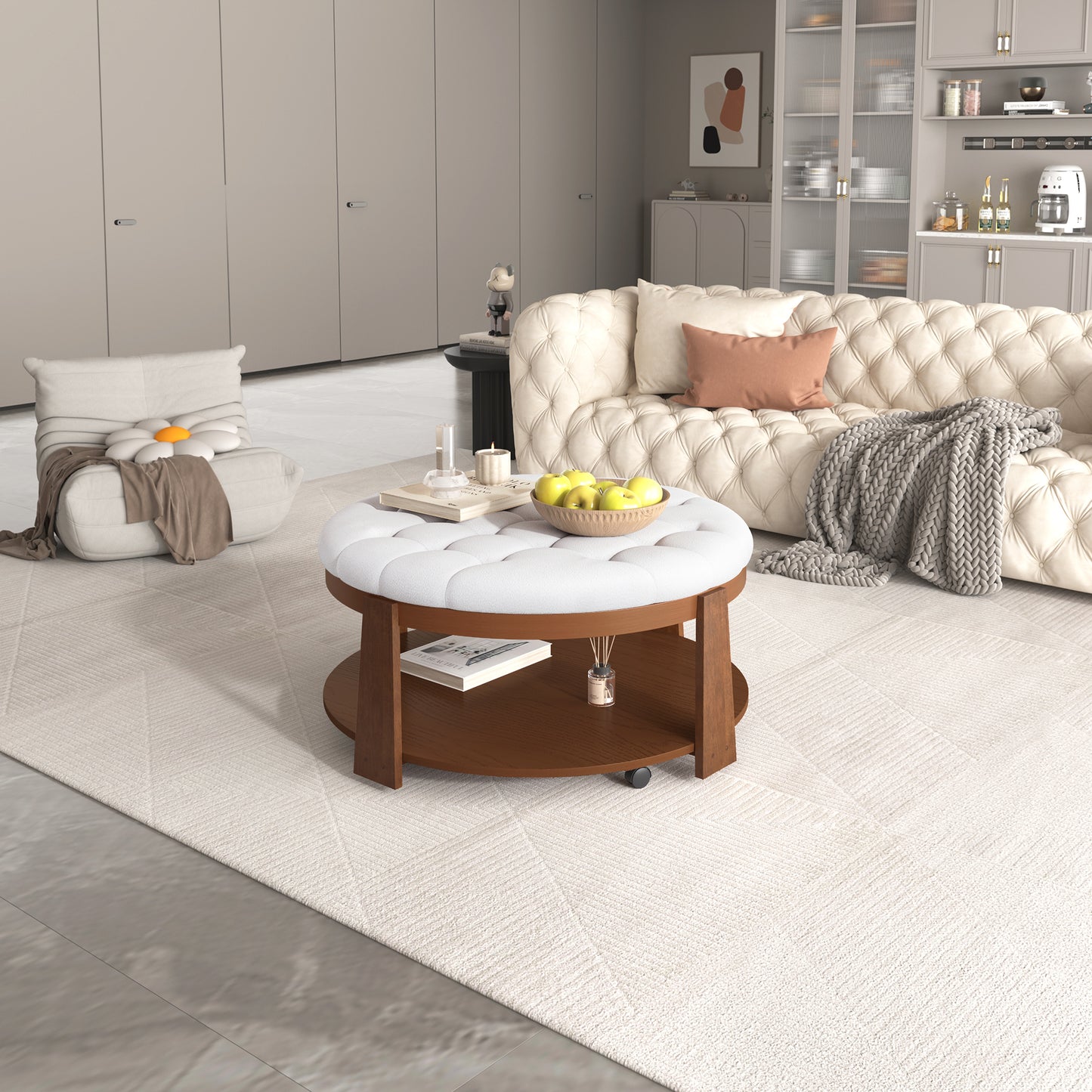 Tufted white ottoman coffee table with dark wood base and decorative apples