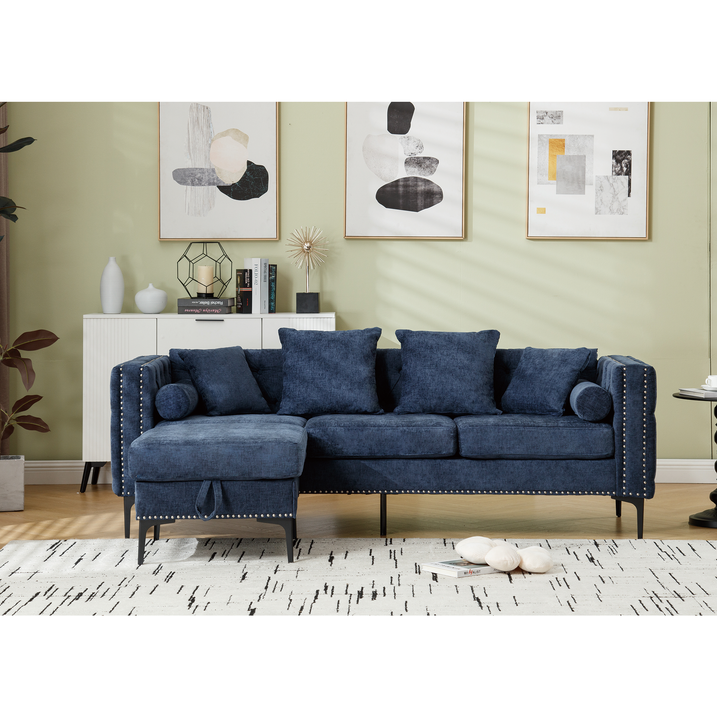 Dark blue chenille sectional sofa with tufted details and silver nailhead trim