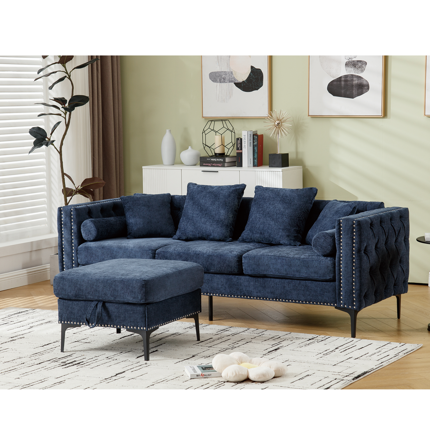 Navy blue tufted Chesterfield sofa with nailhead trim and matching ottoman ideal for living rooms