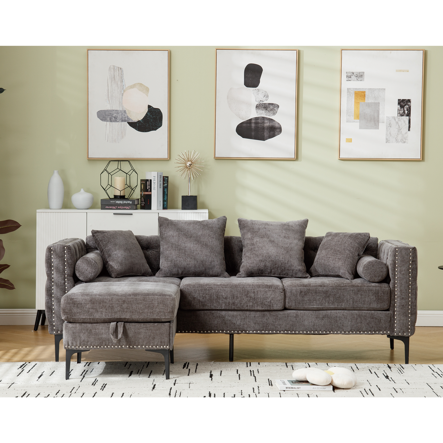 Dark gray chenille fabric sectional sofa with studded trim and storage chaise